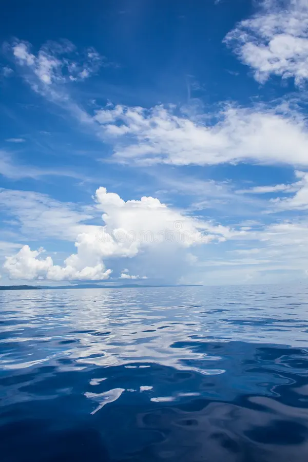 photo blue sea tropical sky clouds seascape sun over water sunset vertical nobody picture ocean background horizontal 74767678